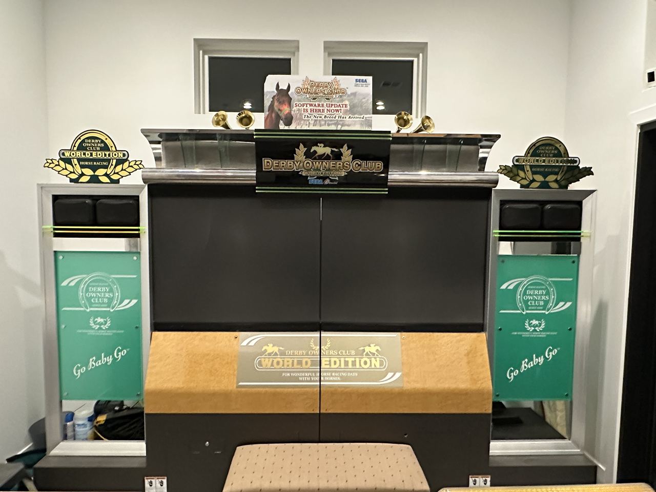 The front of a Derby Owners Club World Edition main cabinet with its marquee and side panels.