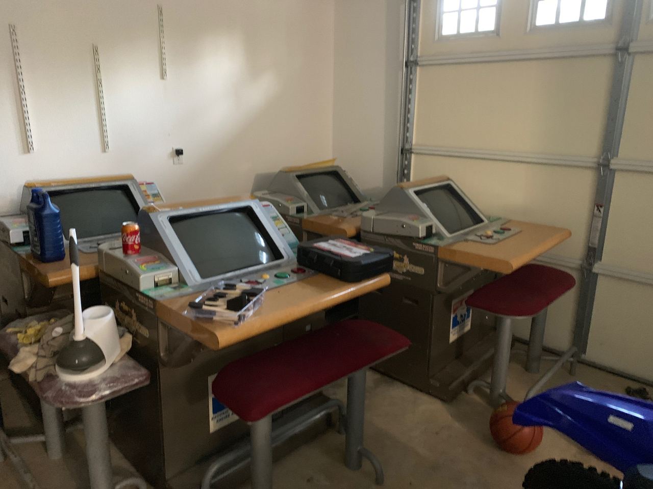 Derby Owners Club satellite seats lined up in a garage awaiting restoration.